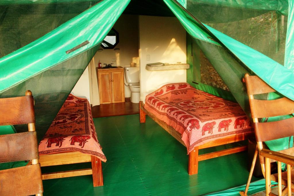 Postel nebo postele na pokoji v ubytování Luna Lodge