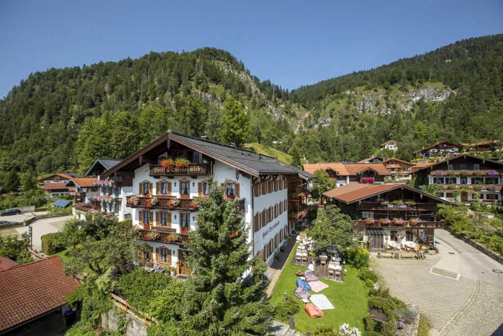 an aerial view of a resort in the mountains at Hotel Oberschmied in Reit im Winkl