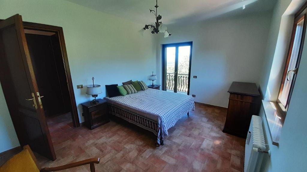 a bedroom with a bed and a window at Villa Pacchini Wellness & Relax Retreat in Poggio Mirteto