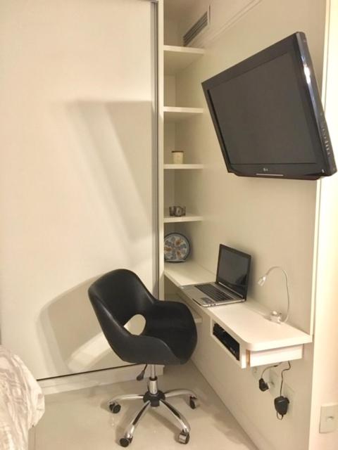 TV a/nebo společenská místnost v ubytování Loft Confortável e Moderno