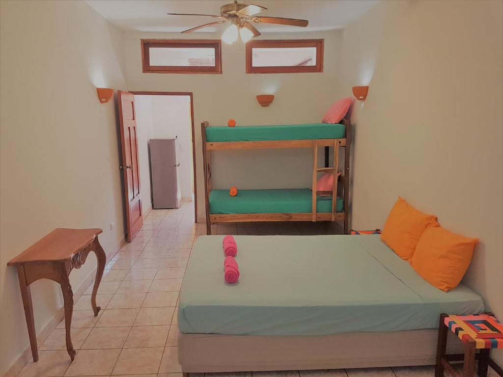 a living room with a couch and a bunk bed at Casa Calala in Granada