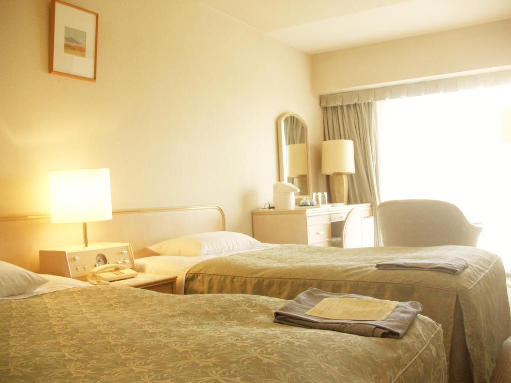 Postel nebo postele na pokoji v ubytování Hotel Heritage