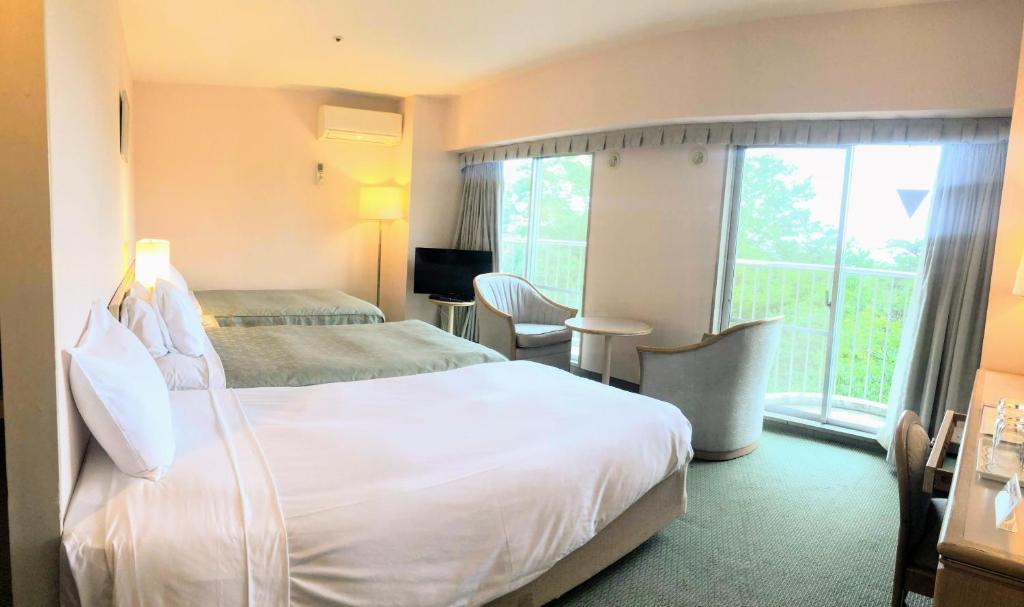Postel nebo postele na pokoji v ubytování Hotel Heritage