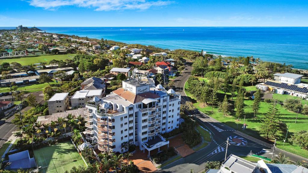 an aerial view of a building next to the ocean at Beachside Resort Kawana Waters in Buddina