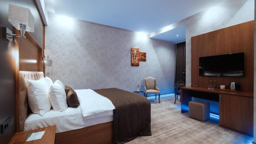 Postel nebo postele na pokoji v ubytování Midtown Hotel Baku