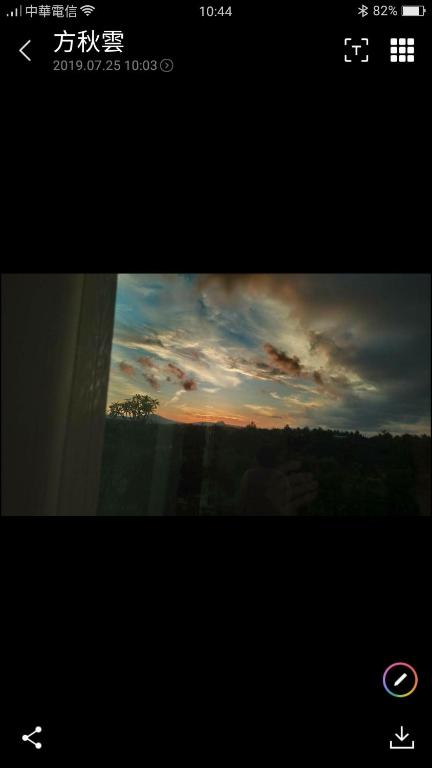 a view of a sunset from a window at Full Moon Resort in Hengchun