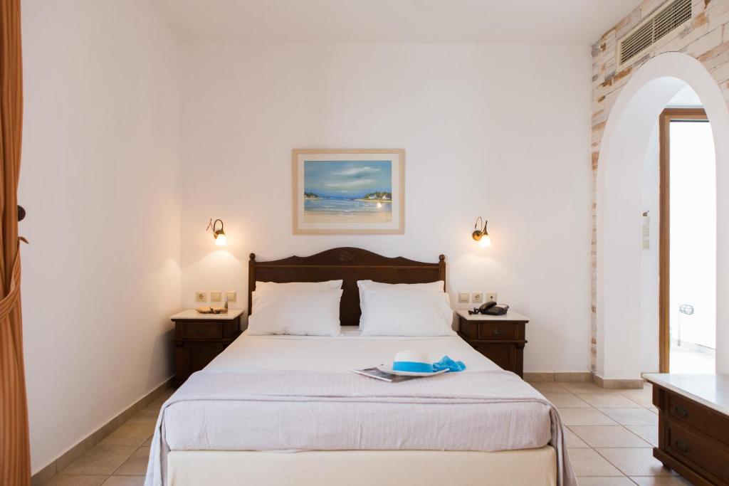 Postel nebo postele na pokoji v ubytování Plaza Beach Hotel