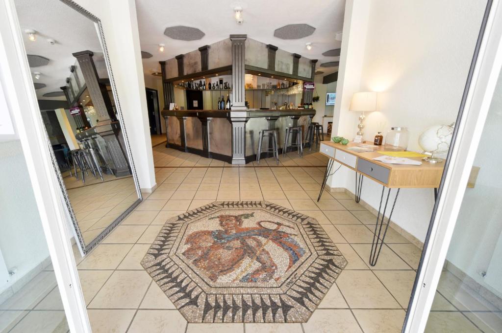Kuchyň nebo kuchyňský kout v ubytování Hôtel des Mosaiques