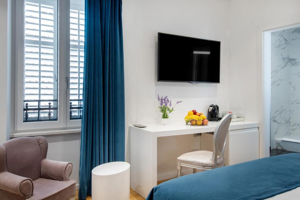 Televízia a/alebo spoločenská miestnosť v ubytovaní Luxury rooms Paula