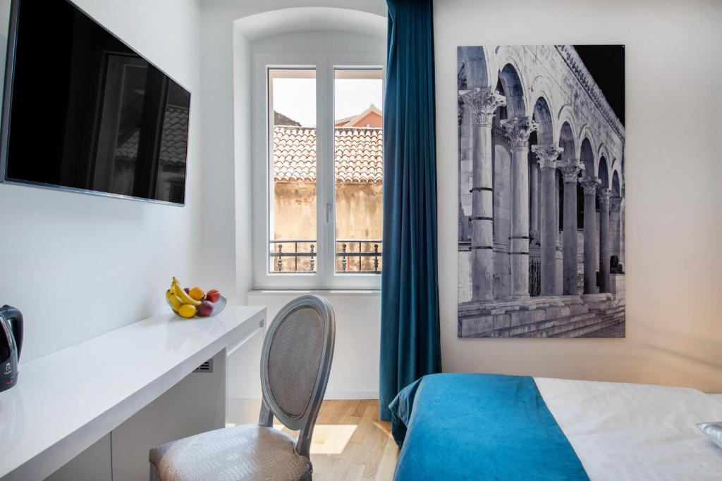 Televízia a/alebo spoločenská miestnosť v ubytovaní Luxury rooms Paula
