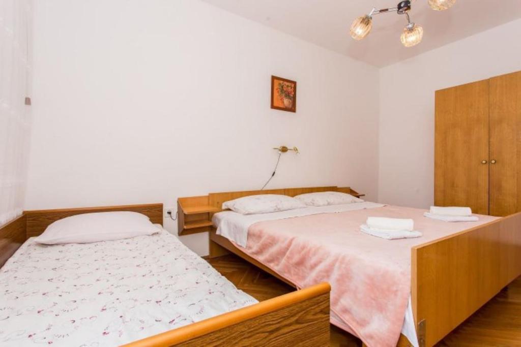 Postel nebo postele na pokoji v ubytování Apartman Morožin