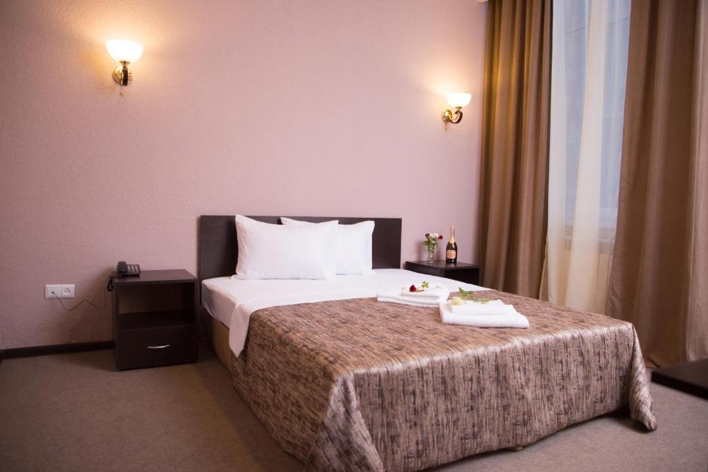 Postel nebo postele na pokoji v ubytování Richmind Hotel