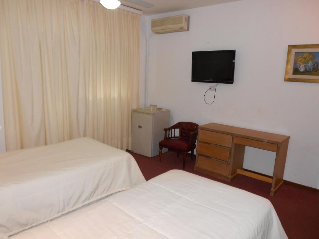 Postel nebo postele na pokoji v ubytování Tanger Hotel