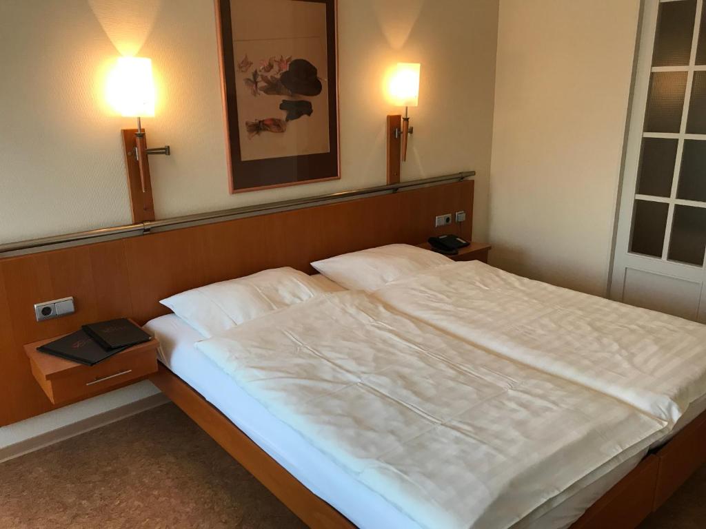 Postel nebo postele na pokoji v ubytování Gasthaus Beinker