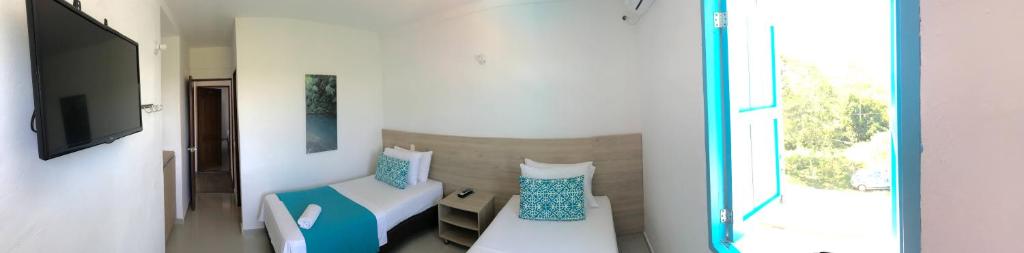 Postel nebo postele na pokoji v ubytování Hotel Aldea Plaza