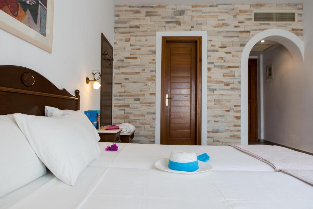 Postel nebo postele na pokoji v ubytování Plaza Beach Hotel