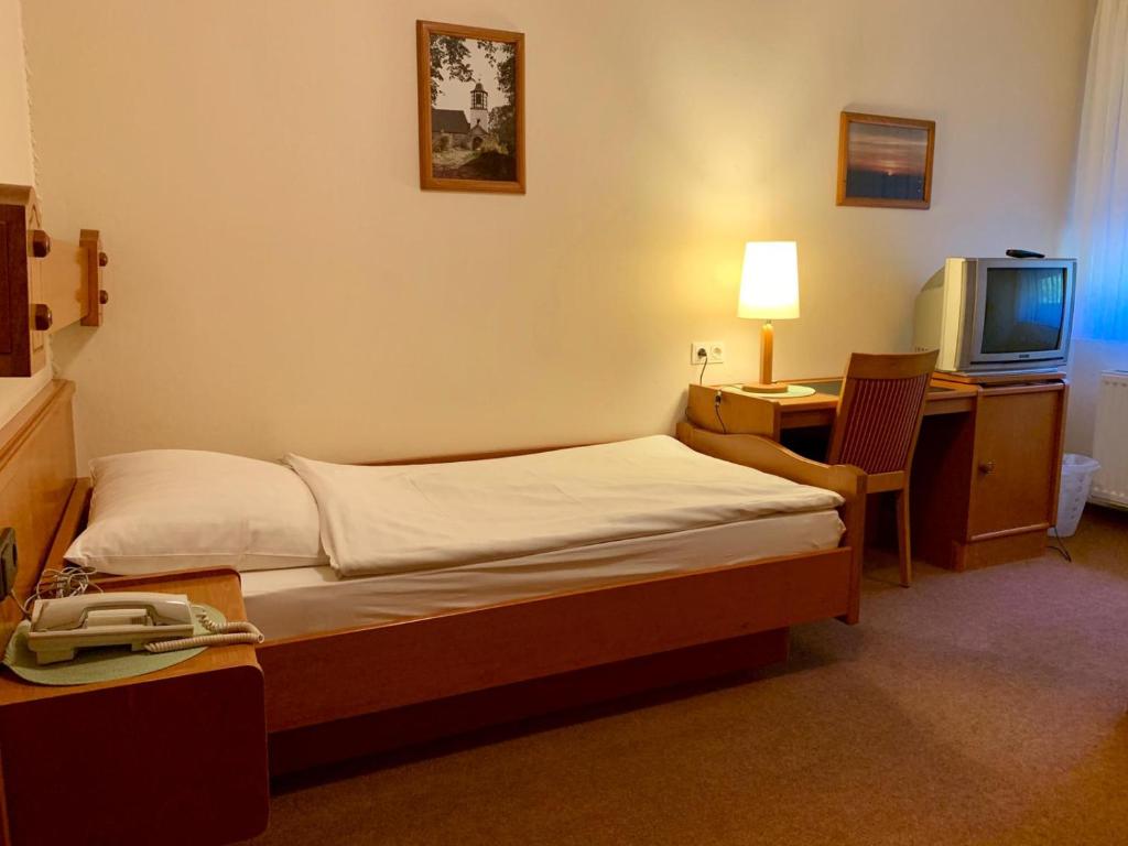 Postel nebo postele na pokoji v ubytování Gasthaus Beinker
