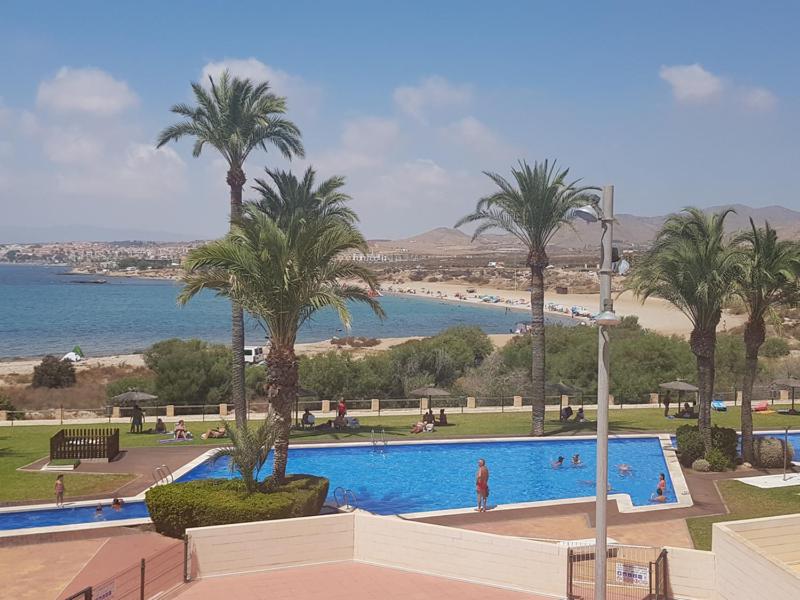 The swimming pool at or close to Apartamento Rosa de Los Vientos VVMU057-23
