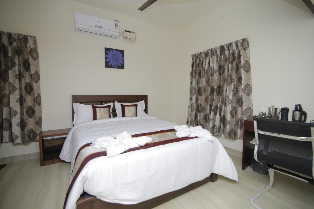 Postel nebo postele na pokoji v ubytování Iris Comfort Inn