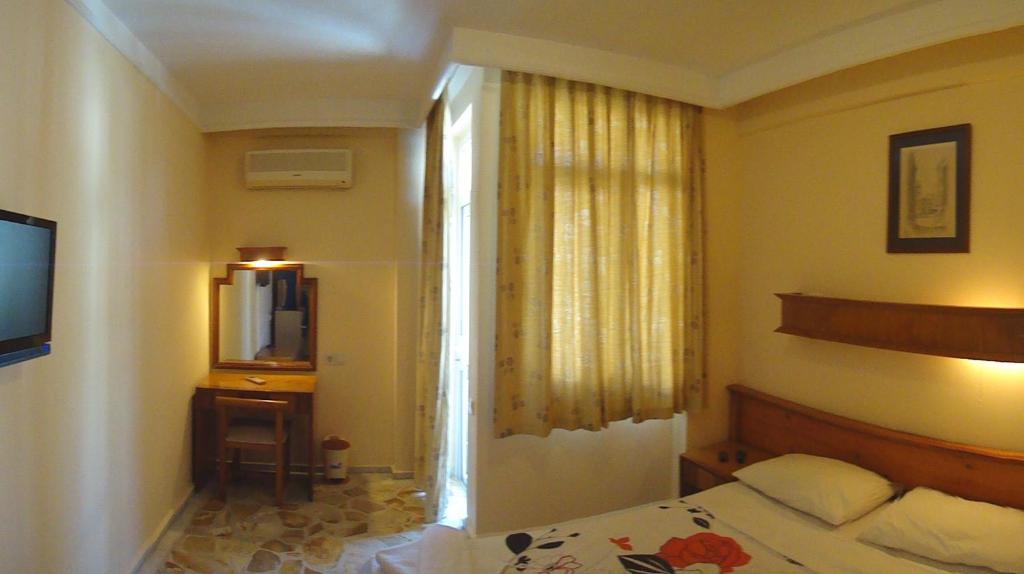 Postel nebo postele na pokoji v ubytování Tuncer Garden Hotel