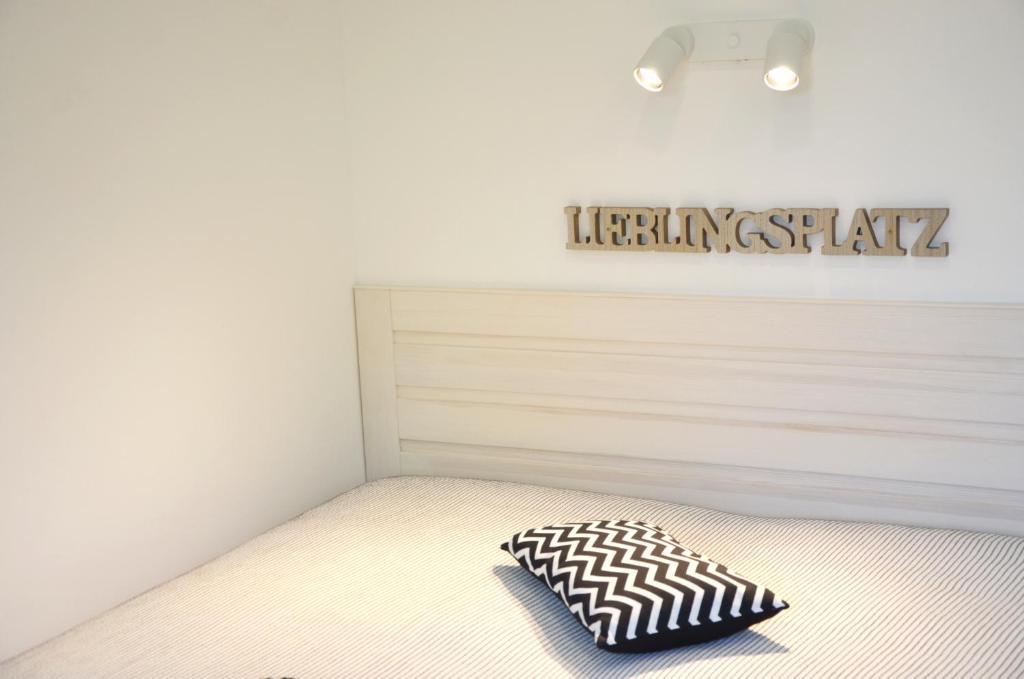 Postel nebo postele na pokoji v ubytování Lieblingsplatz Neusiedl Appartement - Entspann dich
