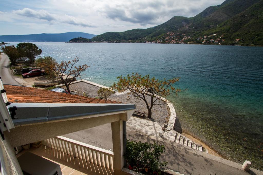 a view of a body of water from a house at Apartmani Vesna in Tivat