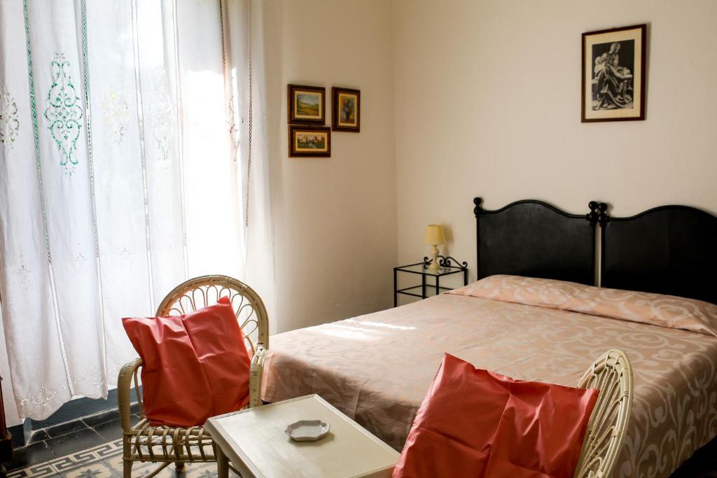 Postel nebo postele na pokoji v ubytování Albergo Pensione Bartoli