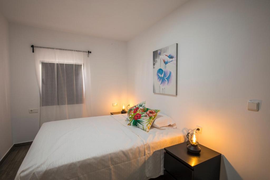 Postel nebo postele na pokoji v ubytování Apartamentos Cáceres Turístico