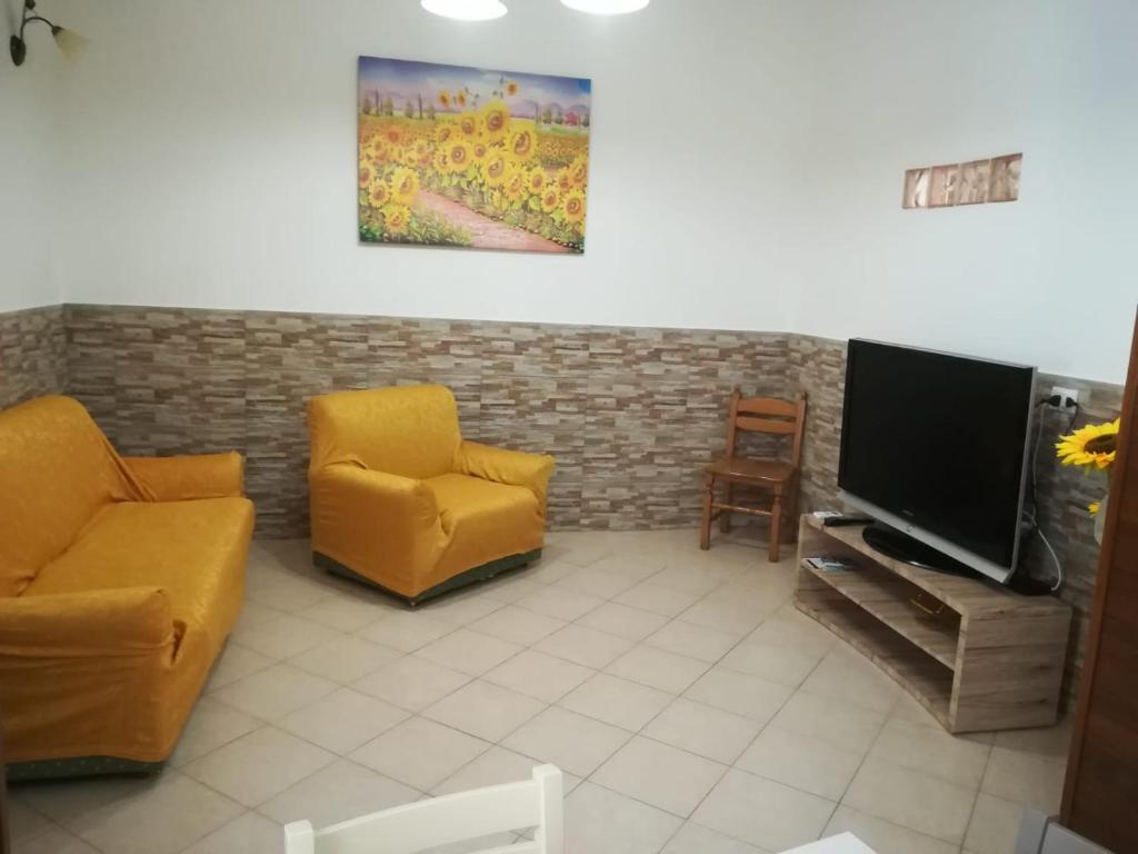 TV a/nebo společenská místnost v ubytování Casa Antica