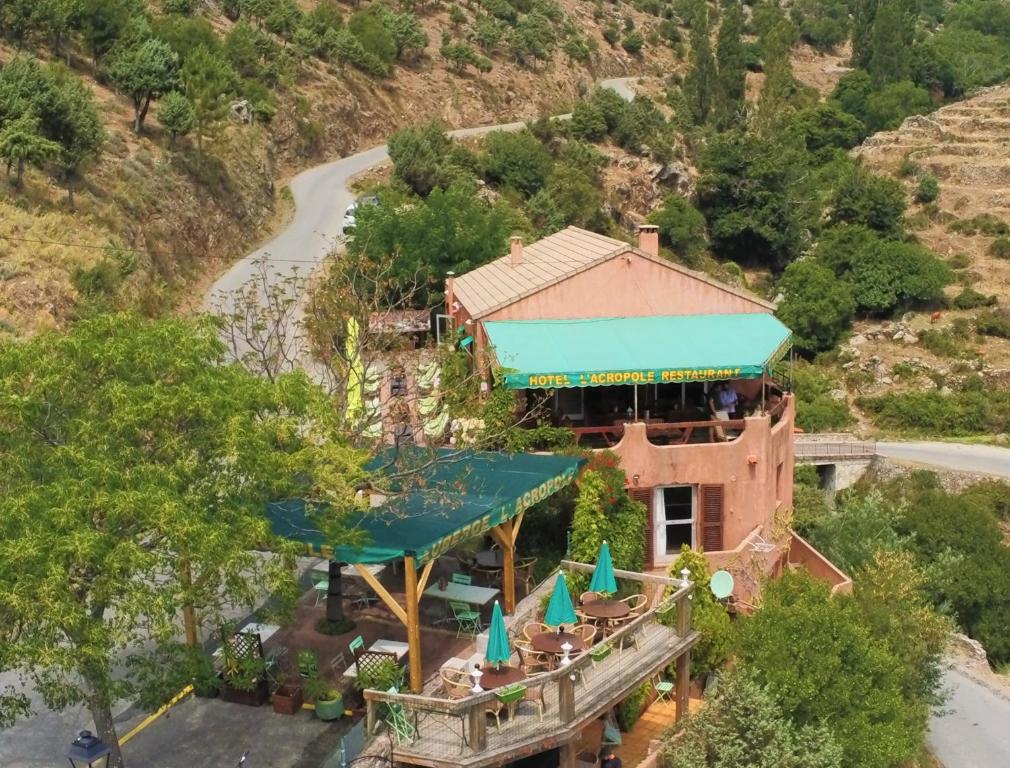 an overhead view of a building with a blue roof at Acropole Asco in Asco