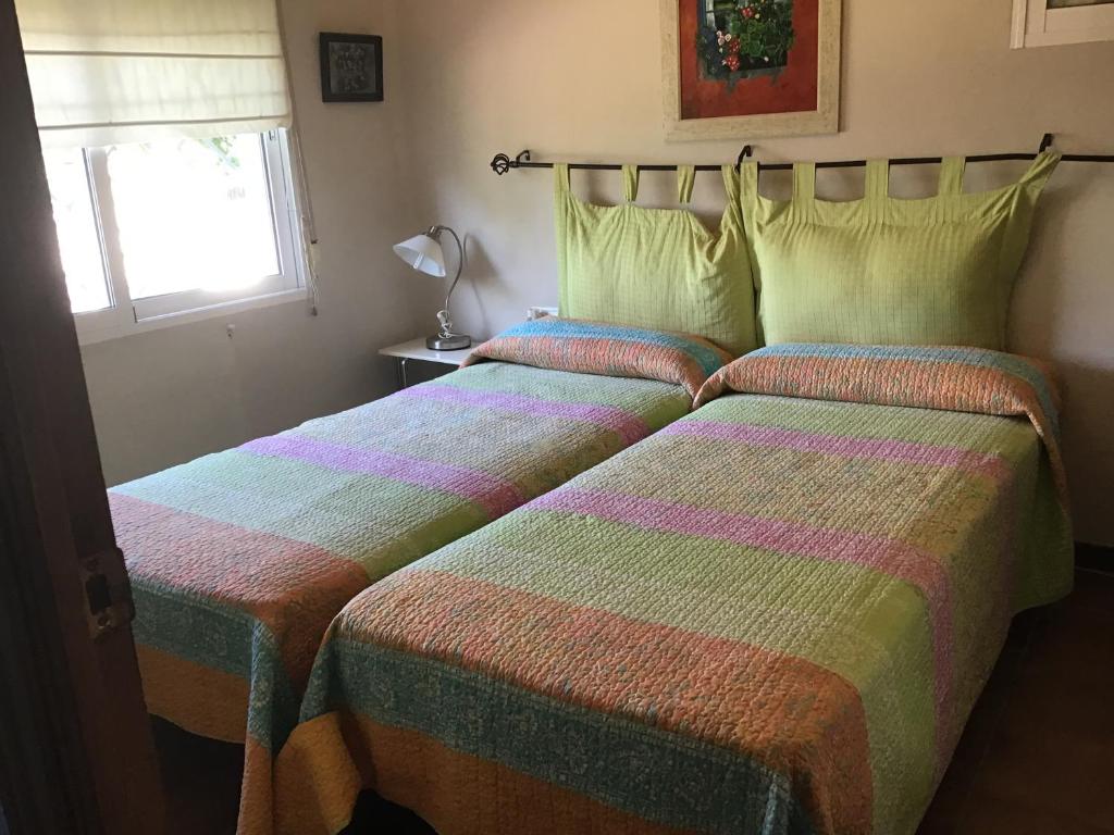 Postel nebo postele na pokoji v ubytování Villa Rosario