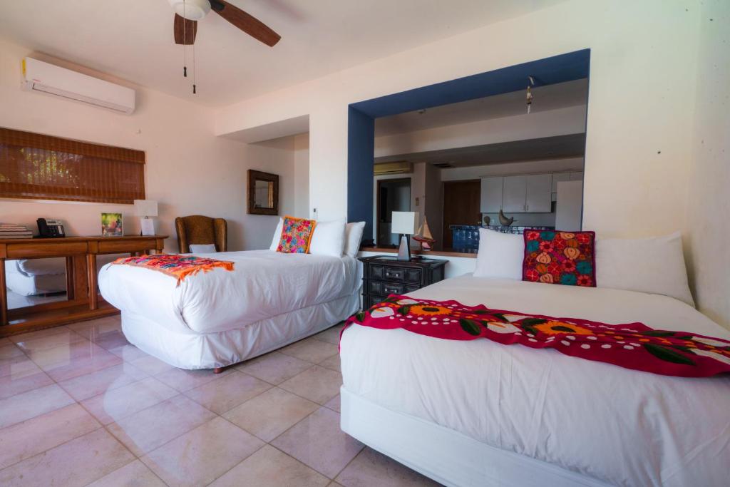 Postel nebo postele na pokoji v ubytování Casa de los Sueños Hotel Boutique