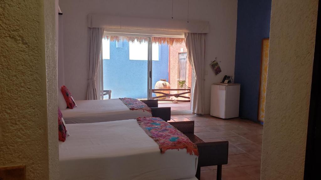 Postel nebo postele na pokoji v ubytování Casa de los Sueños Hotel Boutique