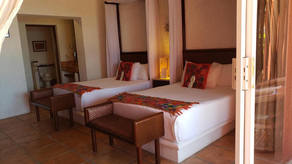 Postel nebo postele na pokoji v ubytování Casa de los Sueños Hotel Boutique