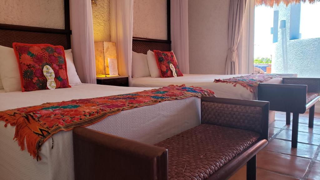 Postel nebo postele na pokoji v ubytování Casa de los Sueños Hotel Boutique
