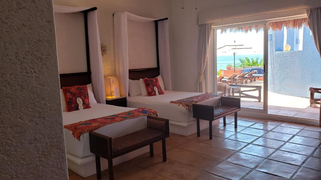 Postel nebo postele na pokoji v ubytování Casa de los Sueños Hotel Boutique