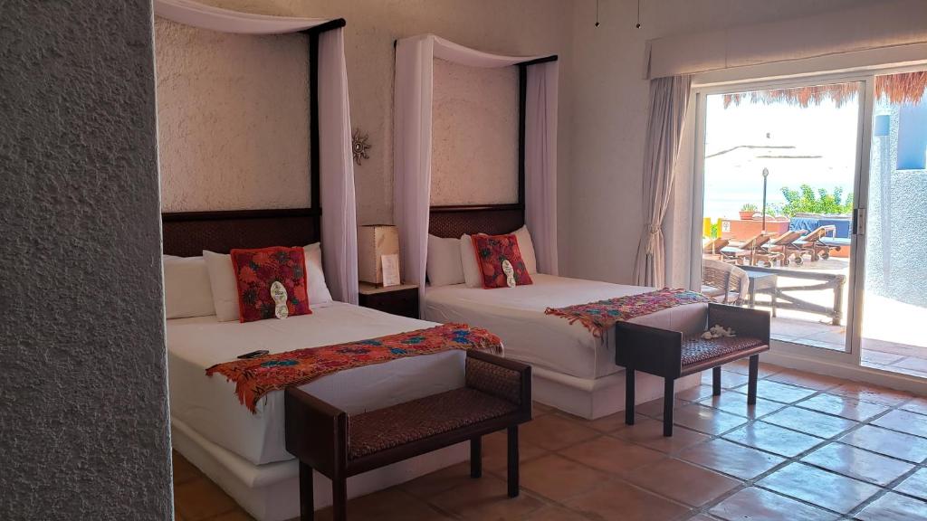 Postel nebo postele na pokoji v ubytování Casa de los Sueños Hotel Boutique
