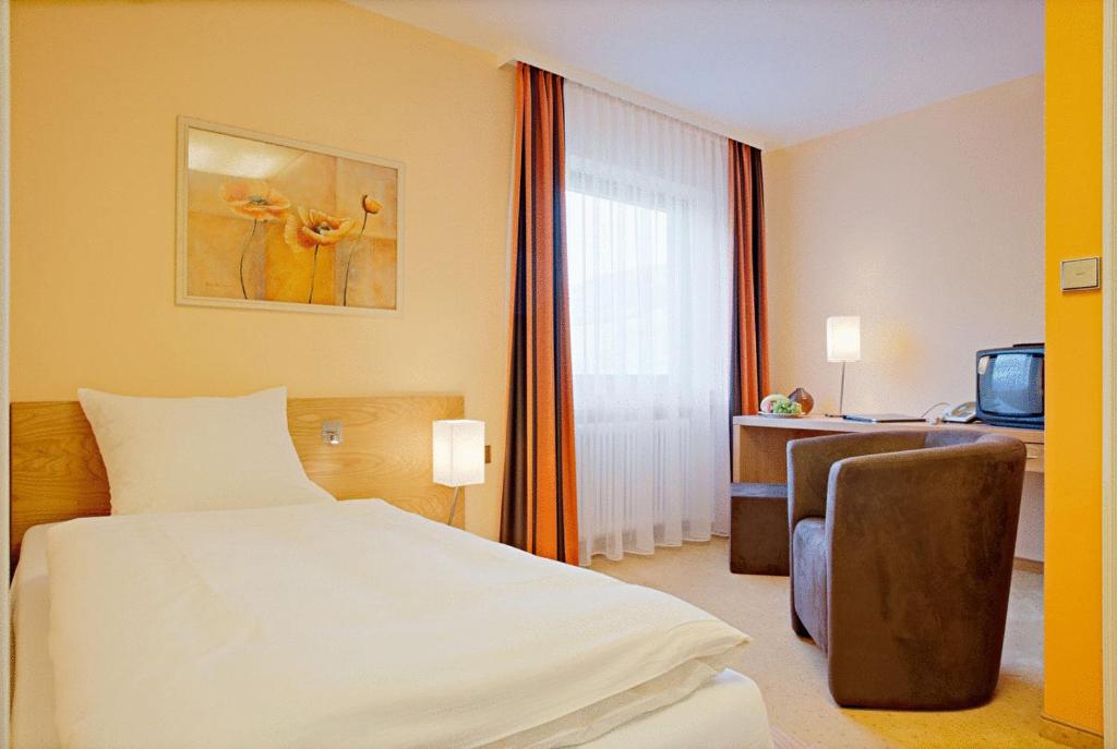 Postel nebo postele na pokoji v ubytování Hotel Fuxxbau