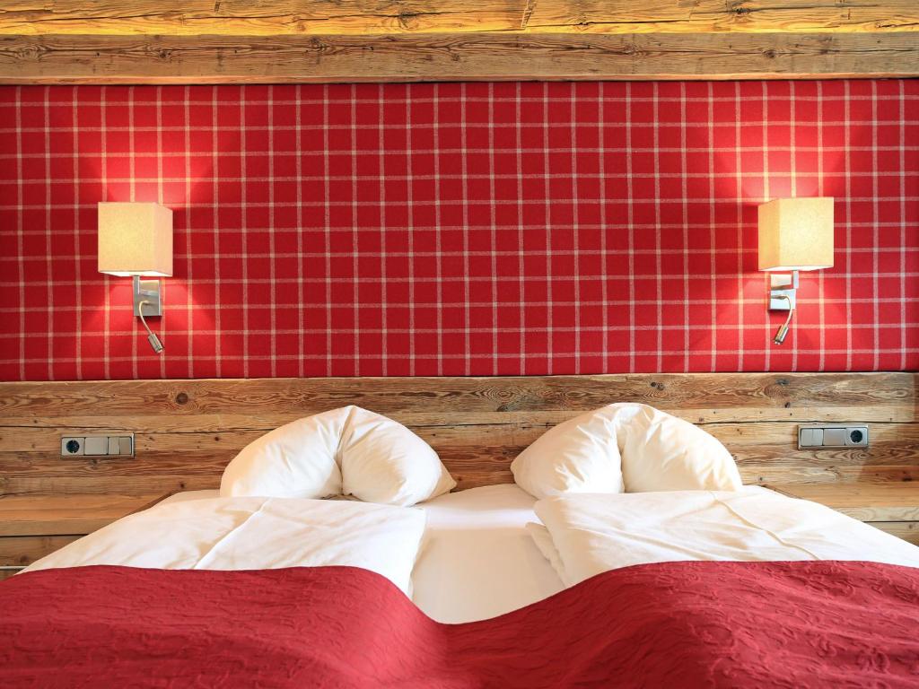 Postel nebo postele na pokoji v ubytování Hotel Alexander