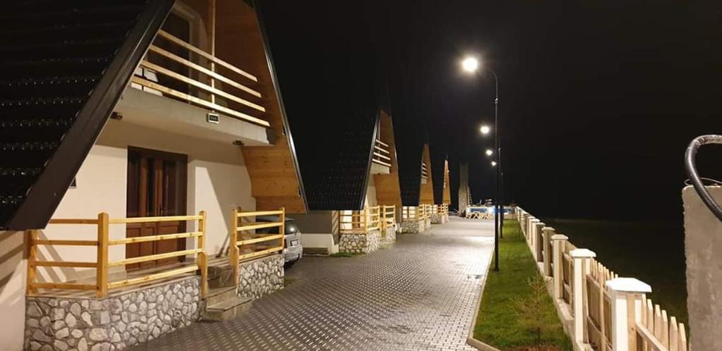 a hallway of a building at night with a street light at Bujtinat e lugines Valbone in Valbonë