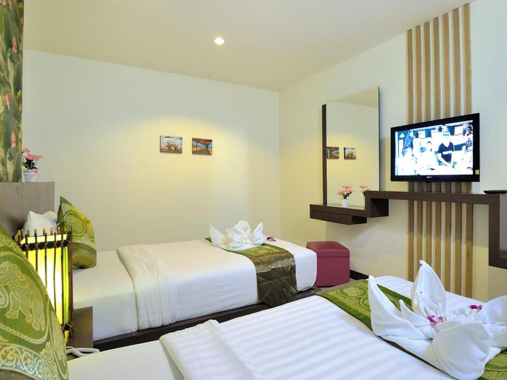 TV a/nebo společenská místnost v ubytování Pimrada Hotel