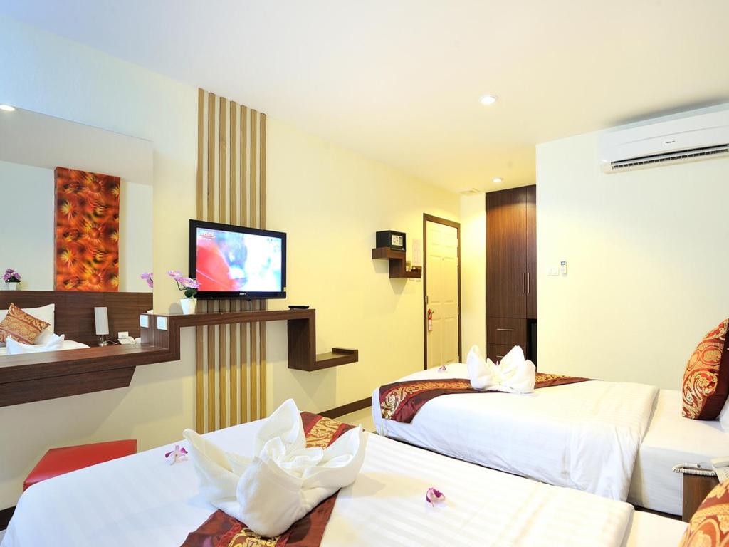 TV a/nebo společenská místnost v ubytování Pimrada Hotel
