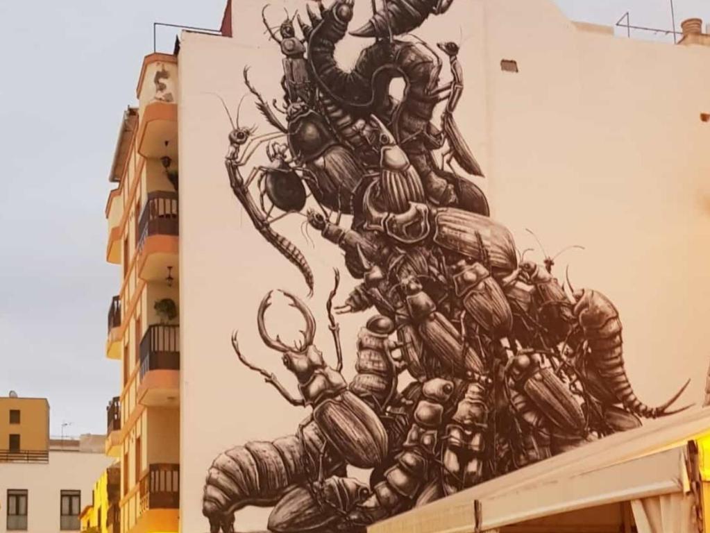 a mural of a group of lobster on a building at San Pedro Family Beach in Puerto de la Cruz