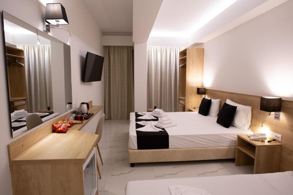 Łóżko lub łóżka w pokoju w obiekcie Marvel Deluxe Rooms