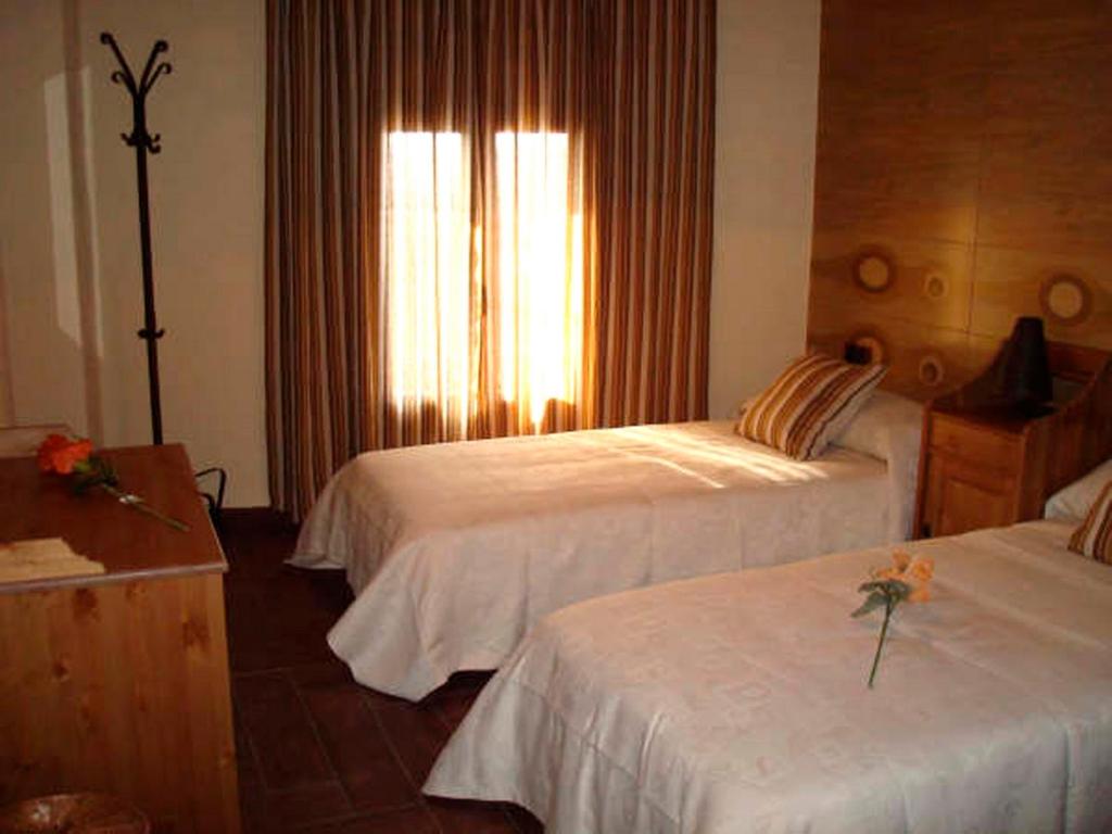 Postel nebo postele na pokoji v ubytování Casa Rural El Planet de Maella Casa rural en Castellon Casa rural con Jacuzzi Casa rural en Xert Casa rural cerca de Morella