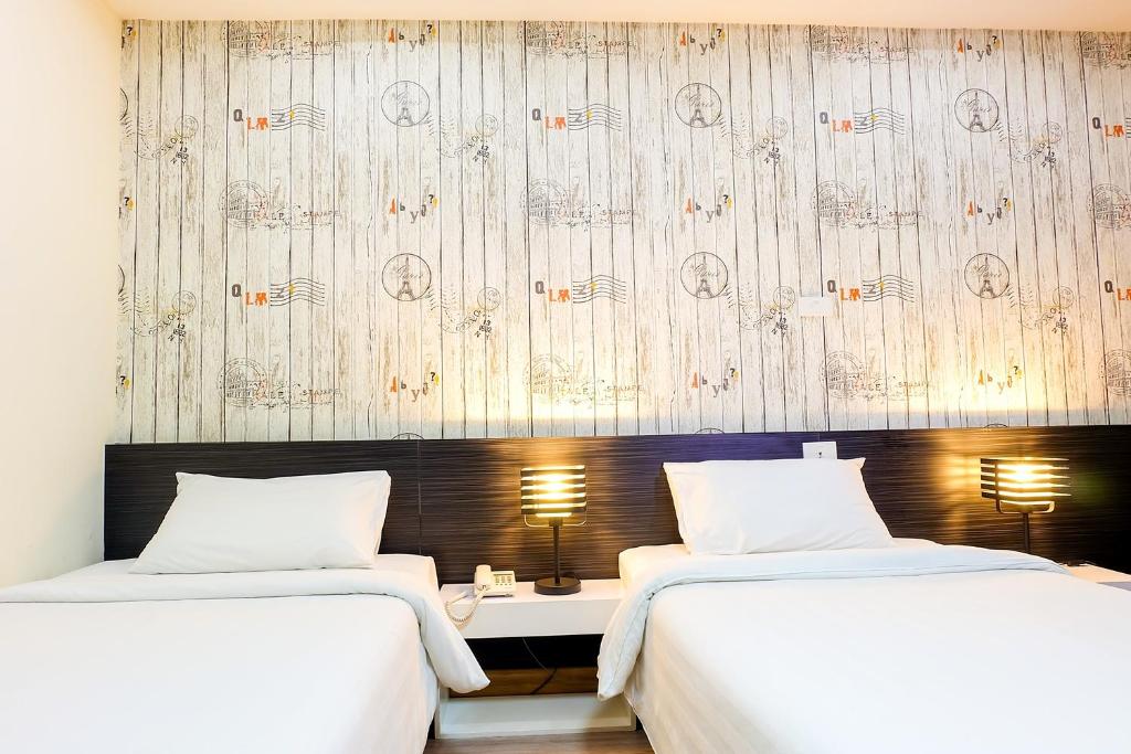 Postel nebo postele na pokoji v ubytování Prajaktra City Hostel