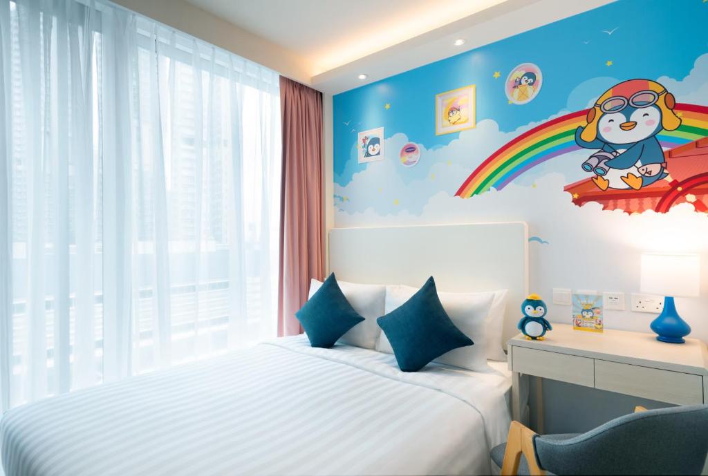 Postel nebo postele na pokoji v ubytování Hotel COZi Resort Tuen Mun