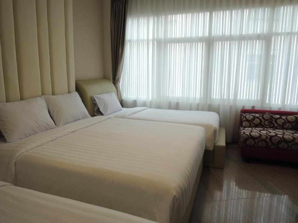 Postel nebo postele na pokoji v ubytování Hotel 55