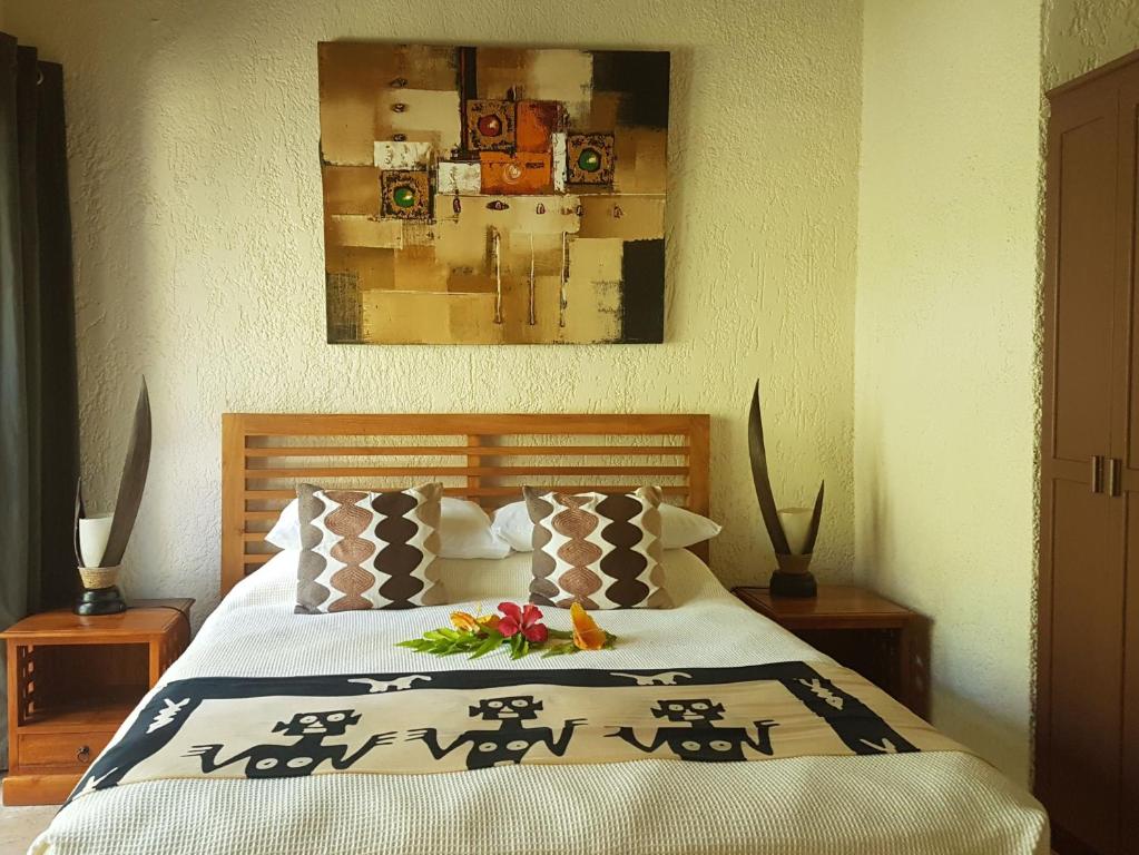 Postel nebo postele na pokoji v ubytování Paradise Cove Resort