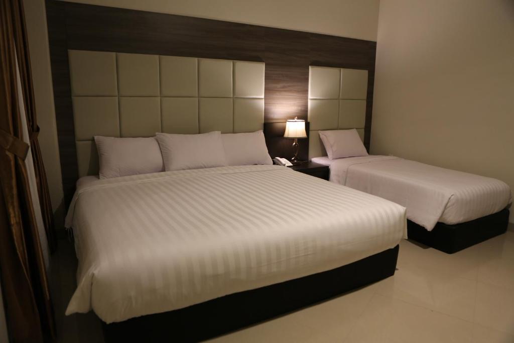 Postel nebo postele na pokoji v ubytování Hotel 55